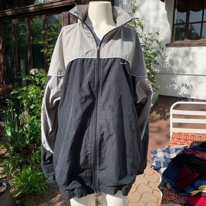 Gray and black Nike windbreaker jacket